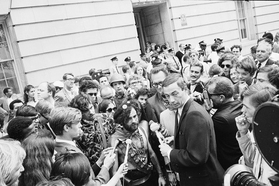 News crews interview American activist Jerry Rubin (1938 - 1994) outside the 1968 Democratic National Convention, Chicago, Illinois, August 1968. Rubin, who founded the Yippees political party, and six others, called the Chicago Seven, were indicted for conspiracy and inciting a riot during the convention. (Photo by Hulton Archive/Getty Images)