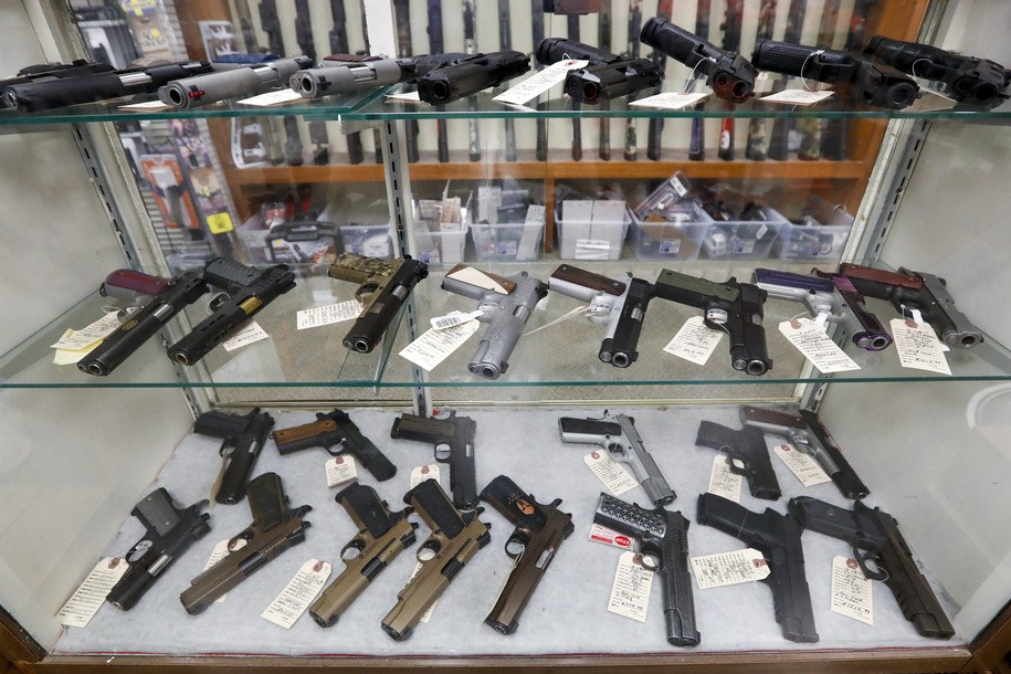 FILE - Semi-automatic handguns are displayed at shop in New Castle, Pa., March 25, 2020. A U.S. judge's ruling Wednesday, May 11, 2023, striking down a federal law that bans licensed federal firearms dealers from selling handguns to young adults under 21 is the latest example of how a landmark Supreme Court decision is transforming the legal landscape around firearms.  (AP Photo/Keith Srakocic, File)