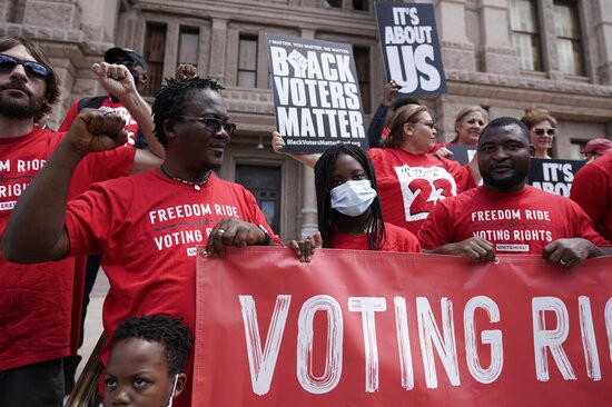 A group joins a rally to support voter rights on the steps of the Texas Capitol, Thursday, July 8, 2021, in Austin, Texas. The Texas Legislature began a special session Thursday. 