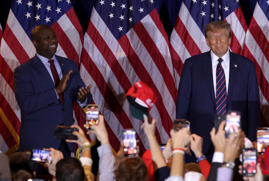 NASHUA, NEW HAMPSHIRE - JANUARY 23: U.S. Sen Tim Scott (R-SC) applauds alongside Republican presidential candidate and former U.S. President Donald Trump during Trump's primary night rally at the Sheraton on January 23, 2024 in Nashua, New Hampshire. New Hampshire voters cast their ballots in their state's primary election today. With Florida Governor Ron DeSantis dropping out of the race Sunday, former President Donald Trump and former UN Ambassador Nikki Haley are battling it out in this first-in-the-nation primary. (Photo by Alex Wong/Getty Images)