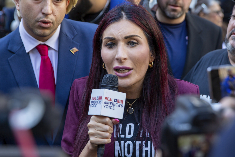 Right-wing activist Laura Loomer is in front of the courthouse where the hush-money trial of Donald Trump got underway Monday, April 15, 2024, in New York. (AP Photo/Ted Shaffrey)