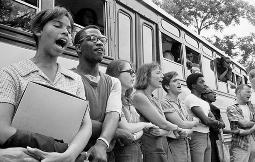 Student civil rights activists singing as they prepare to leave Ohio to register black voters in Mississippi. The 1964 voter registration campaign was known as Freedom Summer. 