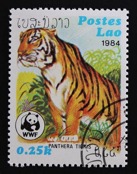 postage stamp showing a tiger, marked Postes Lao and 0.25k