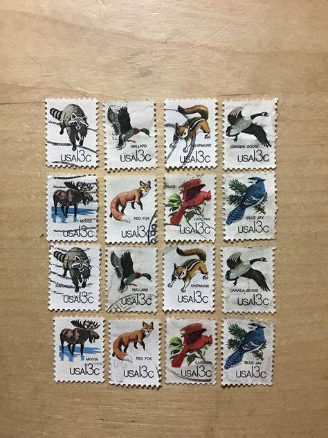 set of 8 US stamps  (two copies of each pictured) of wild animals and birds. Raccoon, duck, chipmunk, goose, moose, fox, cardinal, bluejay.