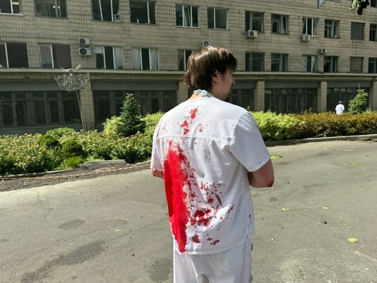 Medical worker covered in blood