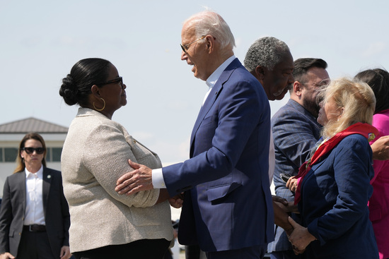 President Joe Biden, right, is greeted by Octavia Spencer upon arriving at Detroit Metropolitan Wayne County Airport in Detroit, Friday July 12, 2024, for a campaign event. (AP Photo/Jacquelyn Martin)