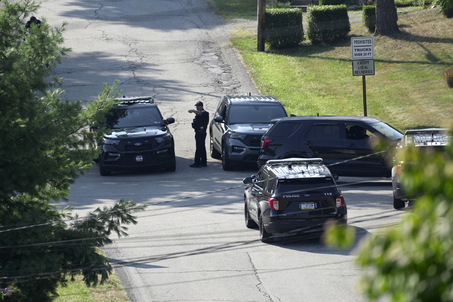 Law enforcement block a street in Bethel Park, Pa., that they say had a residence of Thomas Matthew Crooks, the suspected shooter of former President Donald Trump, Sunday, July 14, 2024. (AP Photo/Joshua A. Bickel)