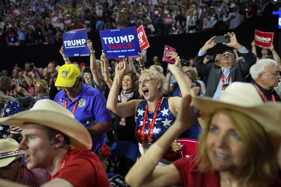 Delegates reacts as Republican presidential candidate former President Donald Trump is introduced during the Republican National Convention Tuesday, July 16, 2024, in Milwaukee. (AP Photo/Jae C. Hong)