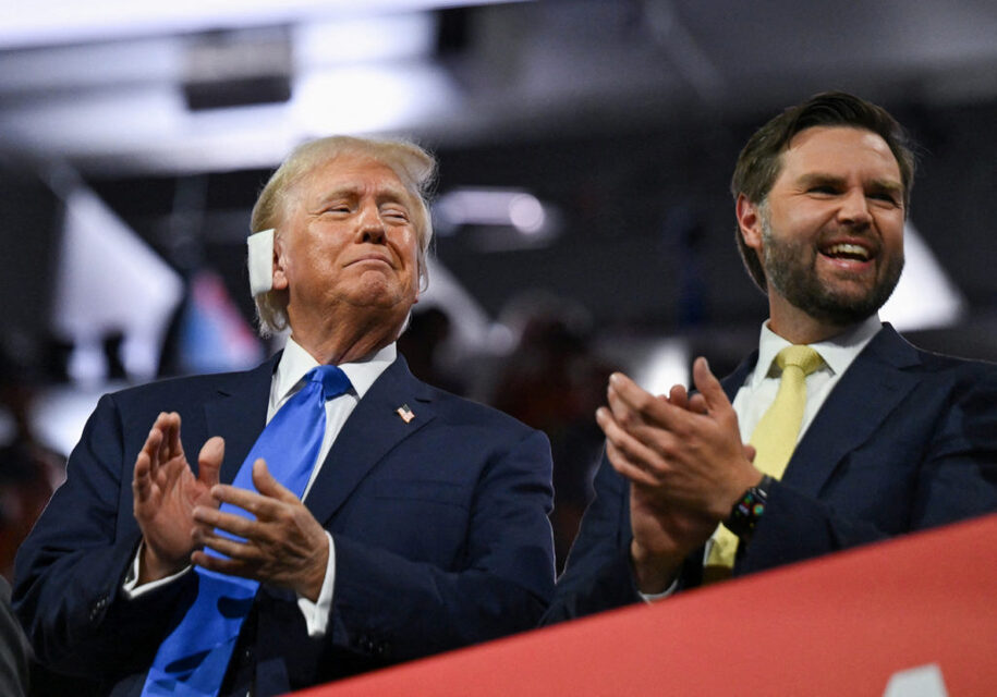 FILE PHOTO: Republican presidential nominee and former U.S. President Donald Trump and Republican vice presidential nominee J.D. Vance applaud on Day 2 of the Republican National Convention (RNC), at the Fiserv Forum in Milwaukee, Wisconsin, U.S., July 16, 2024. REUTERS/Callaghan O'hare/File Photo