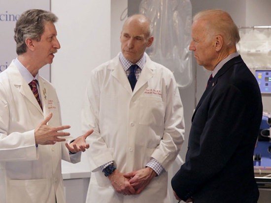 Vice President Joe Biden talks with cancer doctors