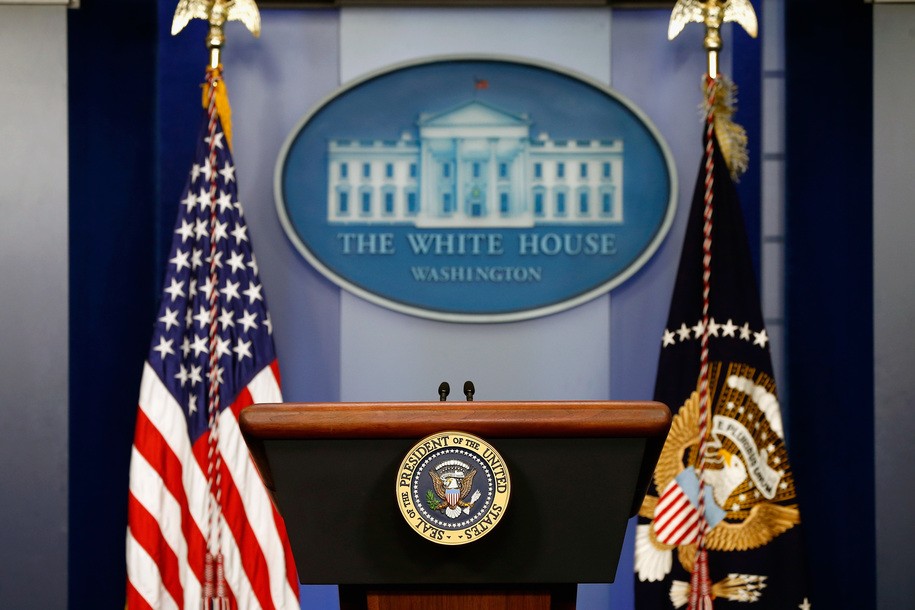 WASHINGTON, DC - AUGUST 18:  The American flag sits next to a empty speaker podium before U.S. President Barack Obama gives a statement during a press conference in the Brady Press Briefing Room of the White House on August 18, 2014 in Washington, DC. Obama returned early from his vacation in Martha's Vineyard to hold meetings with his national security team and also with U.S. Attorney General Eric Holder in regards to the situation in Iraq and the continuing violence in Ferguson, Missouri.  (Photo by Win McNamee/Getty Images)