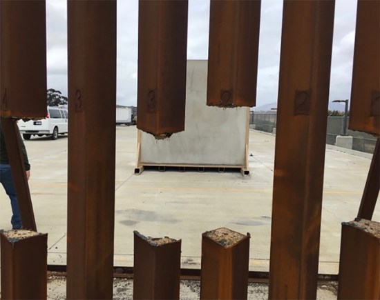 Steel prototype for border wall shown with slats cut out by a saw